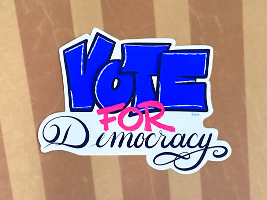 Vote for Democracy sticker on a striped background.