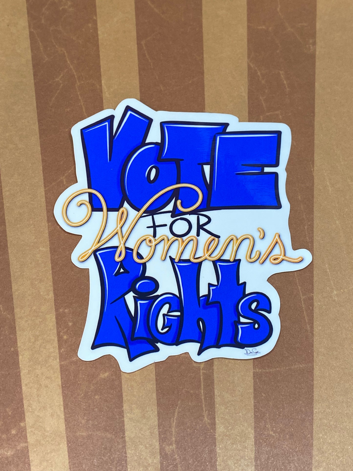 Blue Vote for Women's Rights sticker on a striped background.