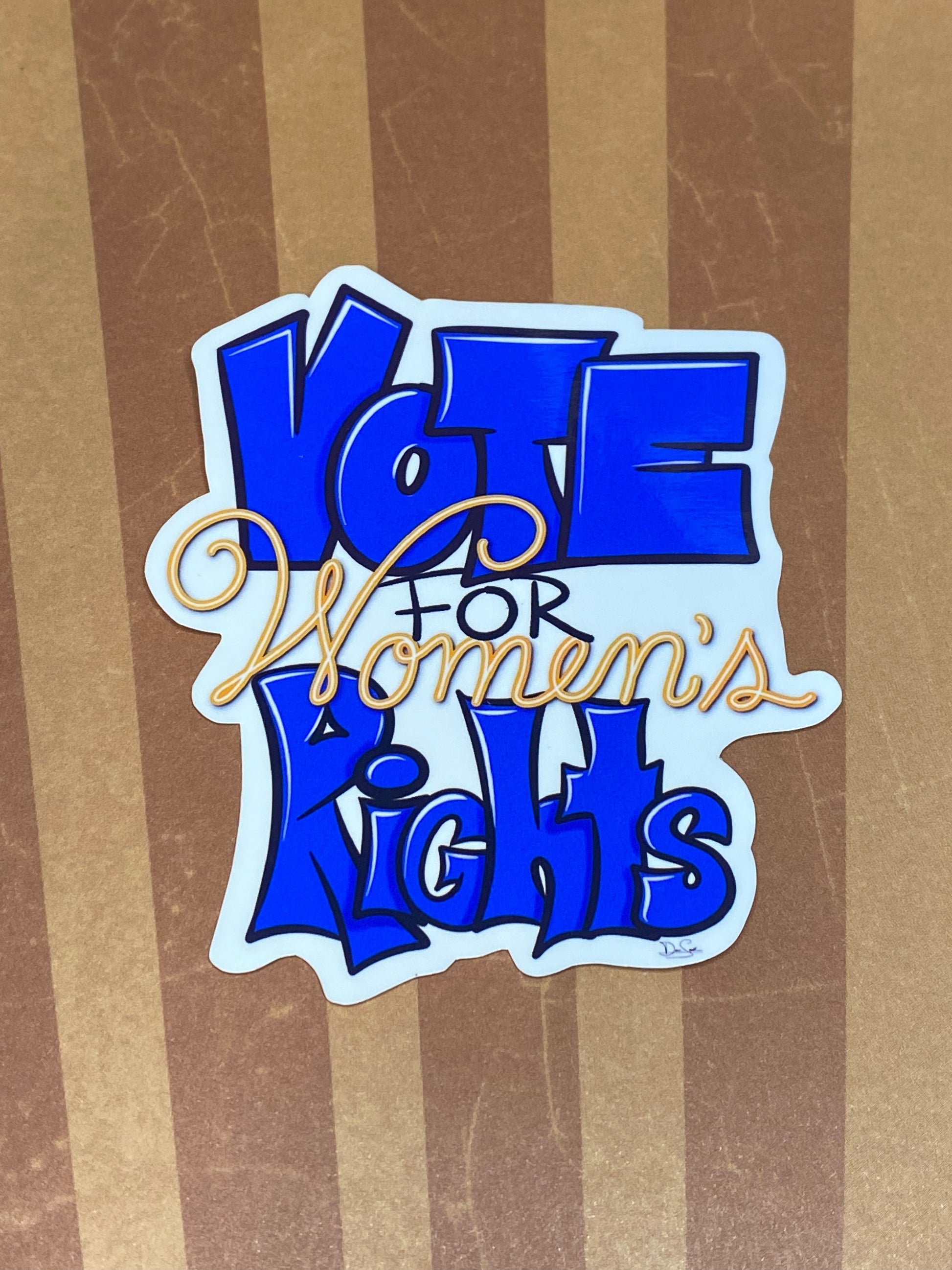 Blue Vote for Women's Rights sticker on a striped background.