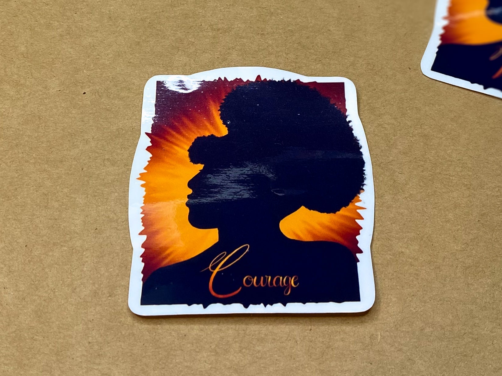 Courage sticker with glossy finish.