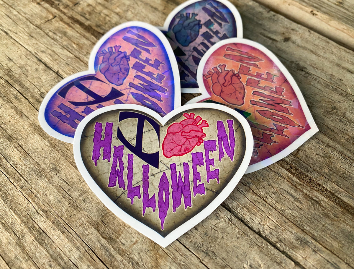 Heart shaped 'I Heart Halloween' stickers in four different colors.