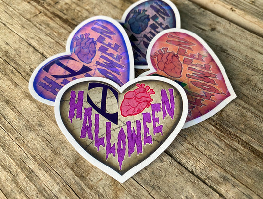 Heart shaped 'I Heart Halloween' stickers in four different colors.