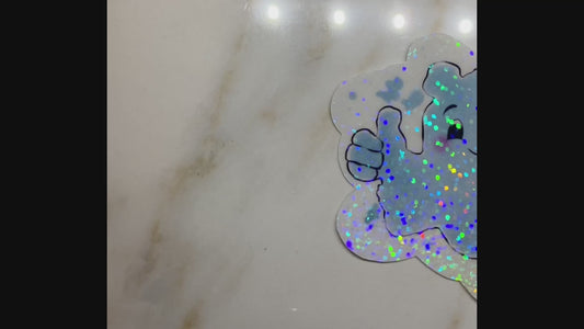 Video showing holographic effect on water spot sticker.