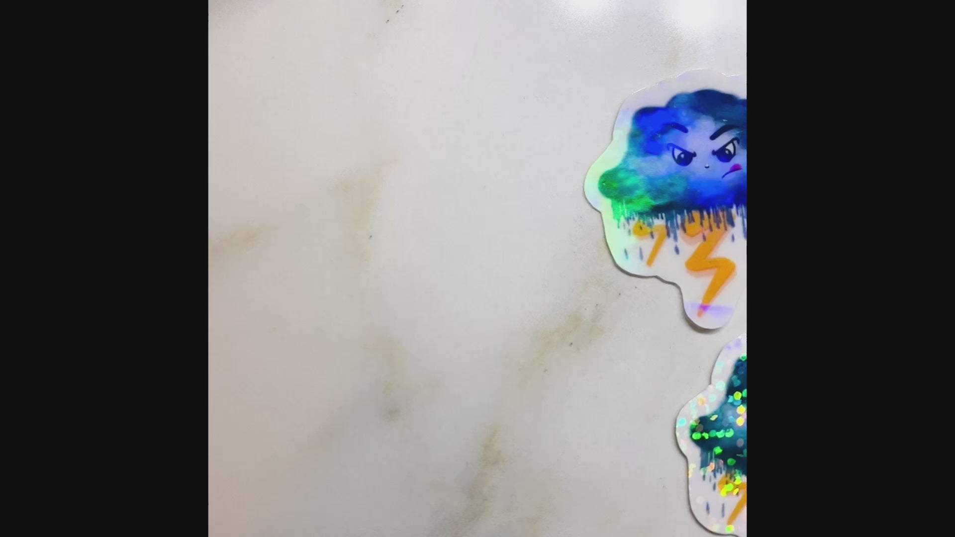 Video showing holographic paper options on the cloud stickers.