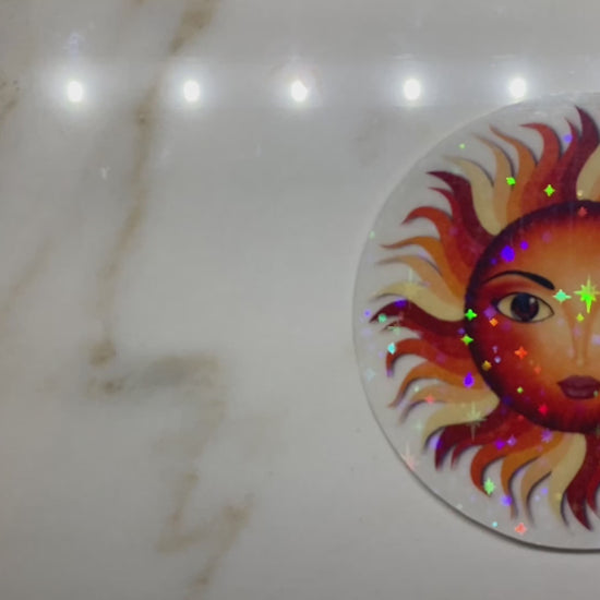 Video showing holographic effect on sun sticker.