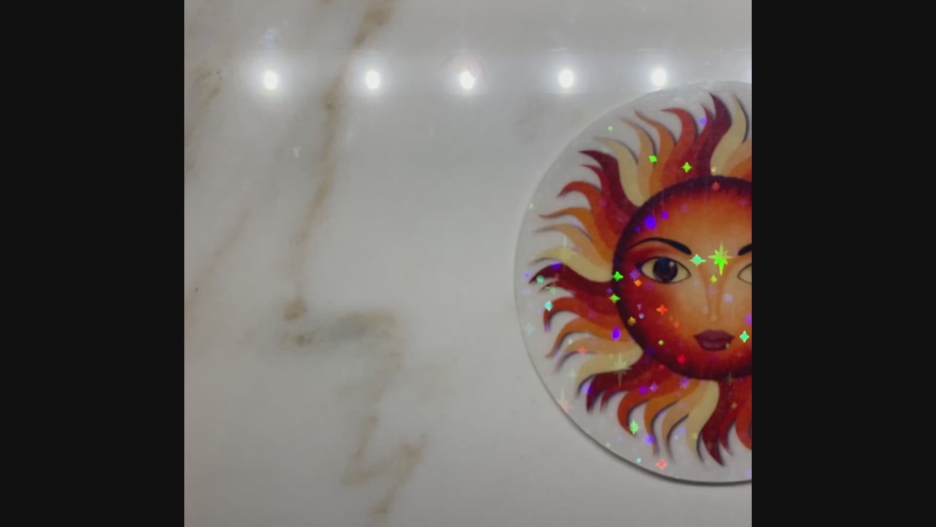 Video showing holographic effect on sun sticker.
